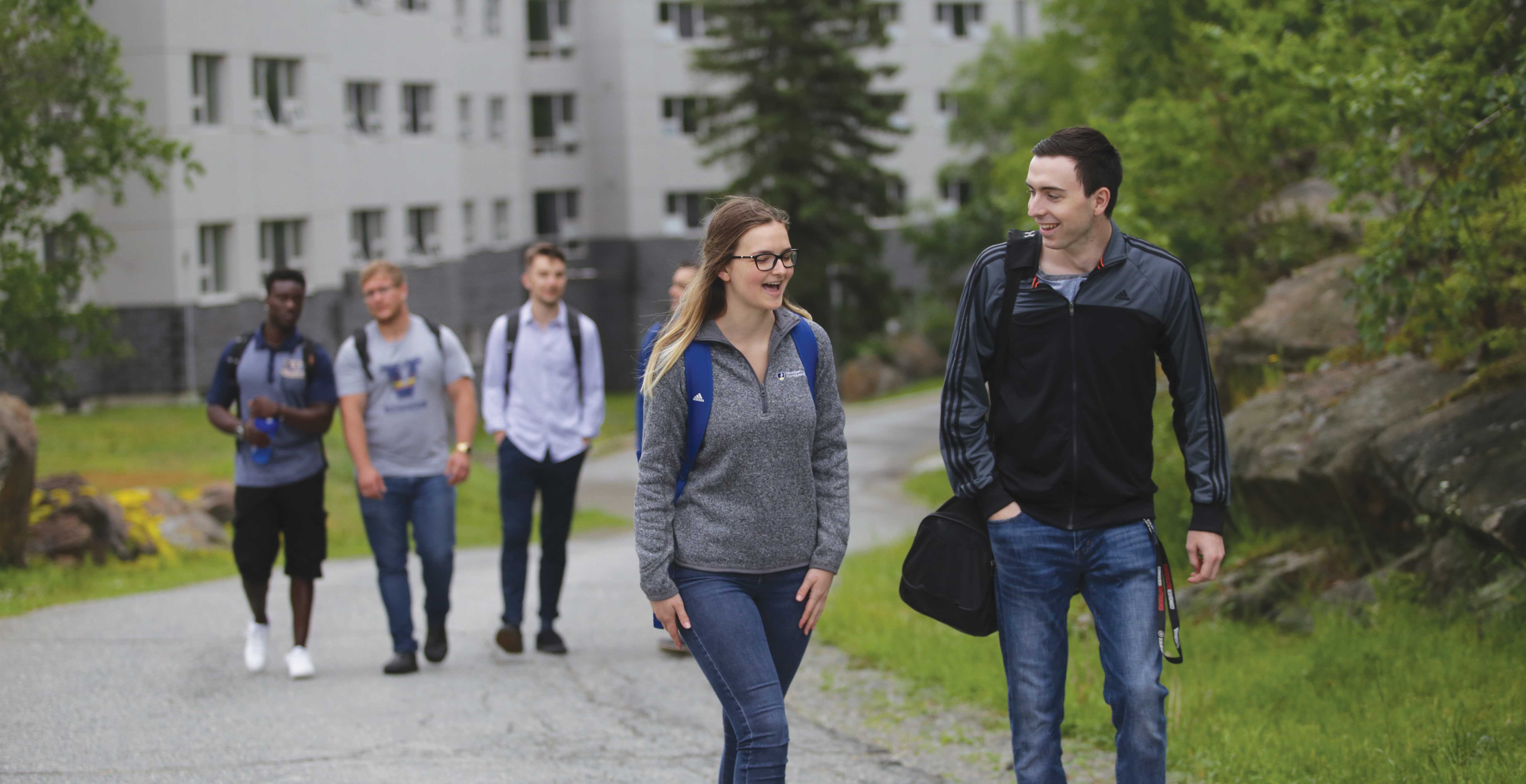 Students walking by a residence